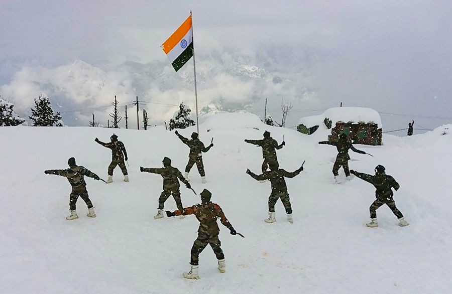Kupwara: Troops of the Indian Army perform 'Khukuri Dance' in the snow-clad ranges of the Tangdhar sector in the Kupwara district of north Kashmir. (PTI Photo)