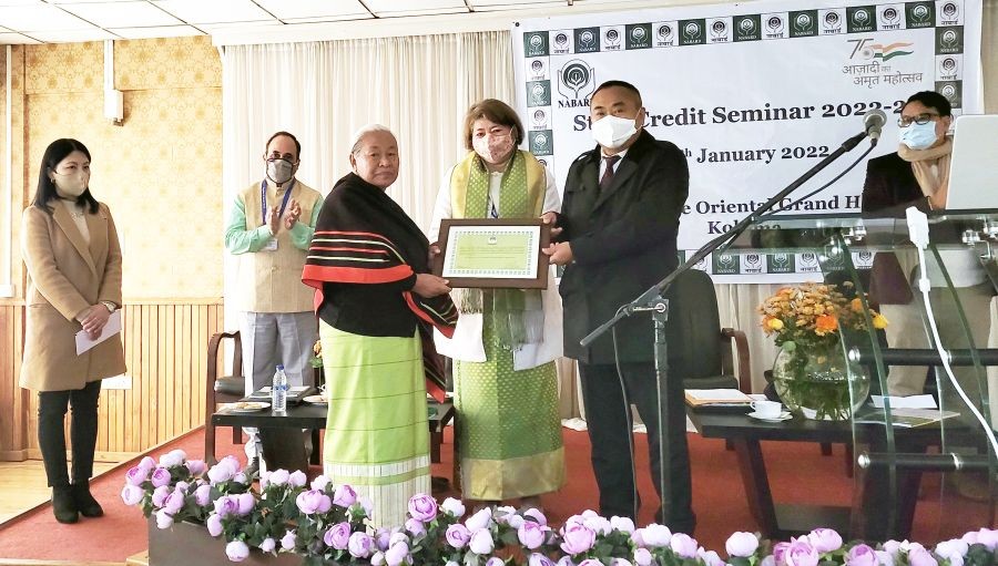 Minister Neiba Kronu hand over award to one of the recipients in Kohima on January 28. (Morung Photo)