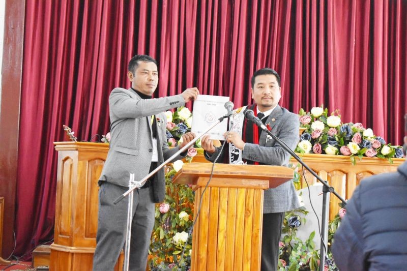 Minister Tongpang Ozukum releasing the jubilee souvenir magazine during the Longkong Students Union platinum Jubilee celebration at Longkong village, on January 6.