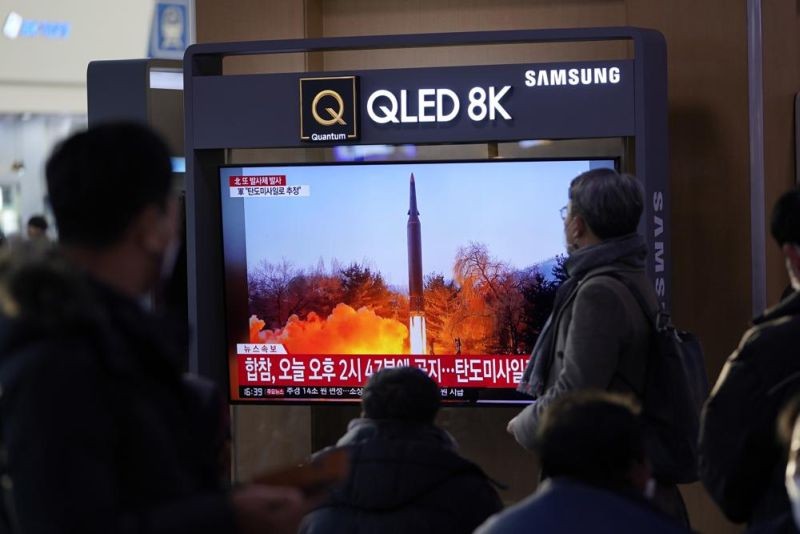 People watch a TV screen showing a news program reporting about North Korea's missile launch with a file image, at a train station in Seoul, South Korea, Friday, Jan. 14, 2022. North Korea on Friday fired two short-range ballistic missiles in its third weapons launch this month, officials in South Korea said, in an apparent reprisal for fresh sanctions imposed by the Biden administration for its continuing test launches. (AP Photo)