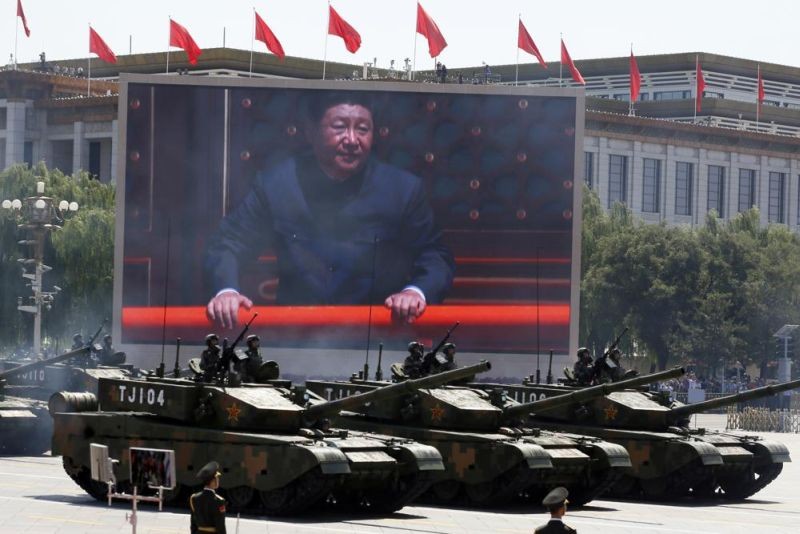 Chinese President Xi Jinping is displayed on a screen as Type 99A2 Chinese battle tanks take part in a parade commemorating the 70th anniversary of Japan's surrender during World War II, held in front of Tiananmen Gate in Beijing on Thursday, Sept. 3, 2015. From the military suppression of Beijing’s 1989 pro-democracy protests to the less deadly crushing of Hong Kong’s opposition four decades later, China’s long-ruling Communist Party has demonstrated a determination and ability to stay in power that is seemingly impervious to Western criticism and sanctions. (AP File Photo)