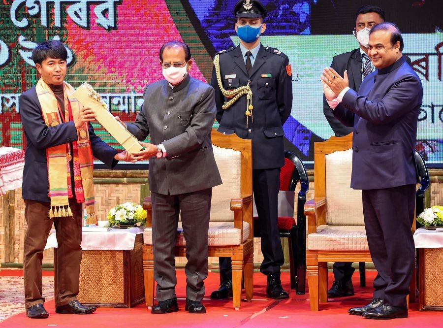 Guwahati: Assam Governor Jagdish Mukhi presents Assam Gaurav Award to mountaineer Khorsing Terang, during a ceremony at Srimanta Sankaradeva Kalakshetra, in Guwahati, Monday, January 24, 2022. Assam Chief Minister Himanta Biswa Sarma is also seen. (PTI Photo)(
