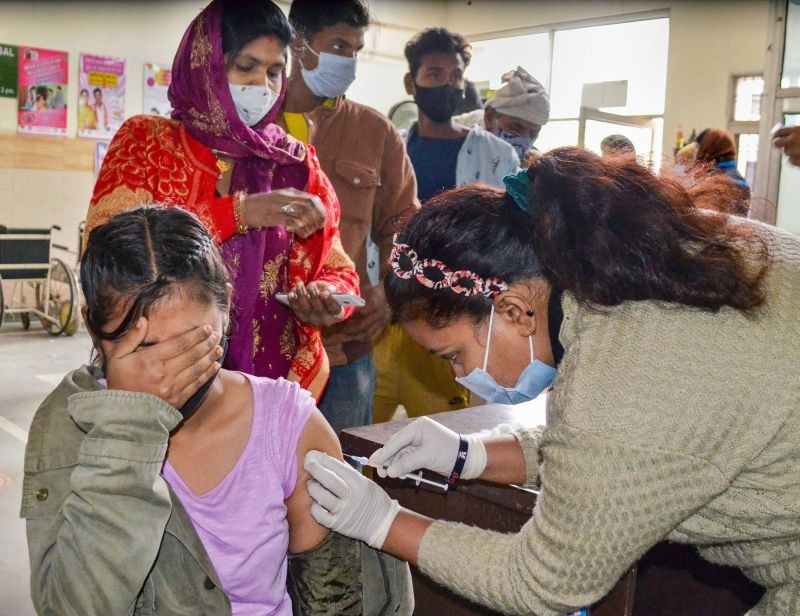 A health worker administers a dose of Covid-19 vaccine to a beneficiary at a vaccination centre, in Gurugram on January 17, 2022. (PTI Photo)