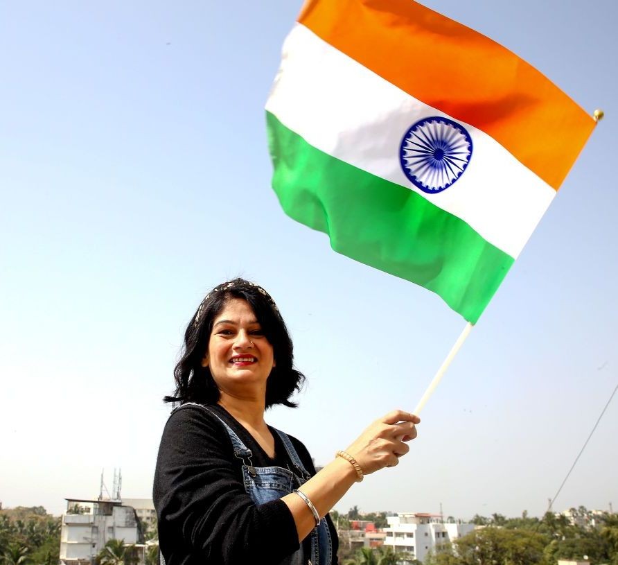 Mumbai: Marathi film actor Resham Tipnis waves the national flag ahead of Republic Day, in Mumbai, Monday, January 24, 2022. (PTI Photo)