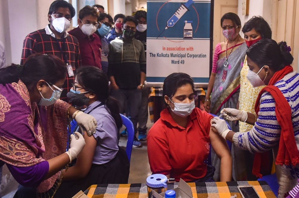 Kolkata: Healthworkers administer a dose of COVID-19 vaccine to teenagers at a school, amid fear of spread of 'Omicron' variant, in Kolkata, Wednesday, Jan.19, 2022. (PTI Photo/Swapan Mahapatra)