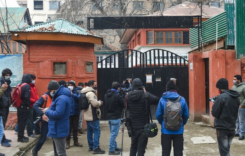 Media personnel assemble outside the Kashmir Press Club building after Jammu and Kashmir Government took back the premises, in Srinagar on January 17, 2022. The administration on Monday took back the premises allotted to the club in the wake of factionalism that erupted in the largest journalists’ body in the valley last week. (PTI Photo)