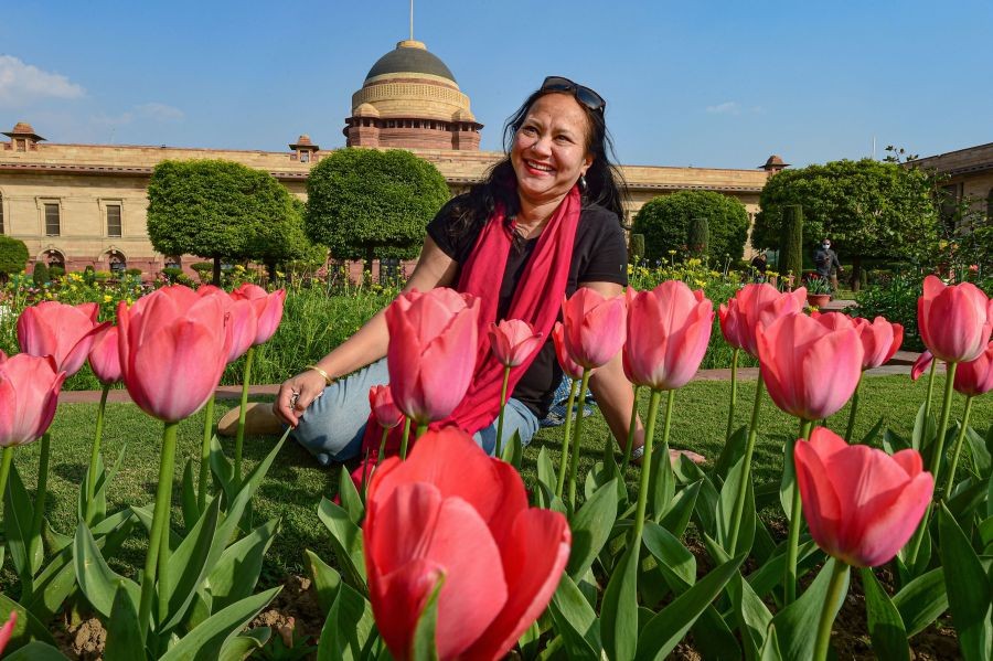 New Delhi: A mediaperson poses for a picture at  Mughal Garden, ahead of its opening for general public, at Rashtrapati Bhawan in New Delhi, Thursday, Feb. 10, 2022. (PTI Photo/Kamal Kishore)