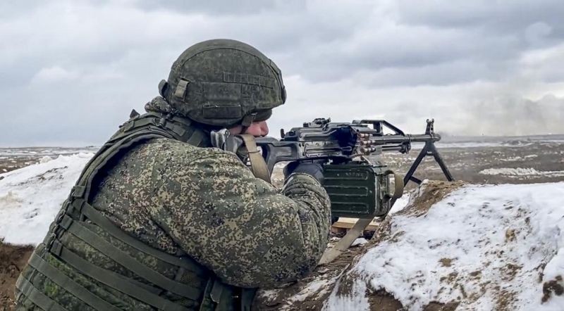 In this photo taken from video and released by the Russian Defense Ministry Press Service on Wednesday, Feb. 2, 2022, a soldier fires during a Russian and Belarusian joint military drills at Brestsky firing range, Belarus. Russian and Belarus troops held joint combat training at firing ranges in Belarus Wednesday as tensions remain high under the looming threat of war with Ukraine. The drills involved motorized rifle, artillery and anti-tank missile units, as well tanks' and armoured personnel carriers' crews. (AP Photo)