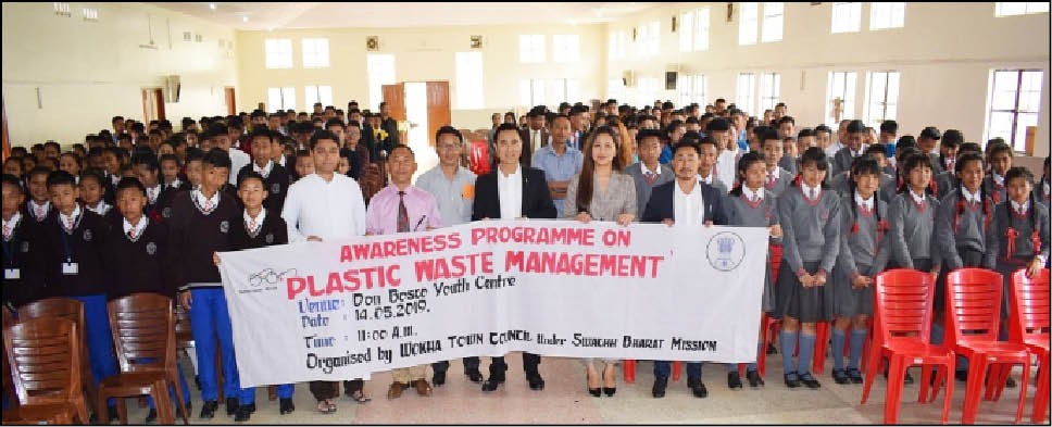 ADC & Administrator WTC, Wokha Andrew C. Imti with officials and students during the Plastic Waste Management held at Youth Centre, DBHSS Wokha on May 14. (DIPR Photo)