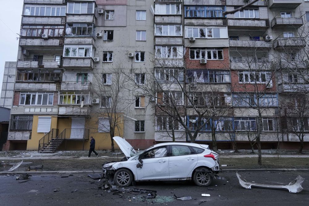 Mariupol : A view of a damaged car in the aftermath of Russian shelling, parked in a street in Mariupol, Ukraine, Thursday, Feb. 24, 2022. Russia launched a wide-ranging attack on Ukraine on Thursday, hitting cities and bases with airstrikes or shelling, as civilians piled into trains and cars to flee. Ukraine's government said Russian tanks and troops rolled across the border in a ‚Äúfull-scale war‚Äù that could rewrite the geopolitical order and whose fallout already reverberated around the world.  AP/PTI