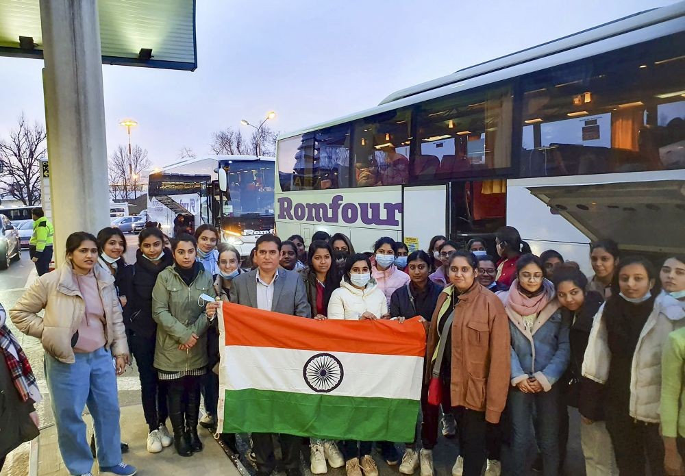 Romania: Indian nationals hold the tricolor before boarding a special Air India flight as people stranded in war-torn Ukraine are evacuated, in Romania, Saturday, Feb. 26, 2022. (PTI Photo)