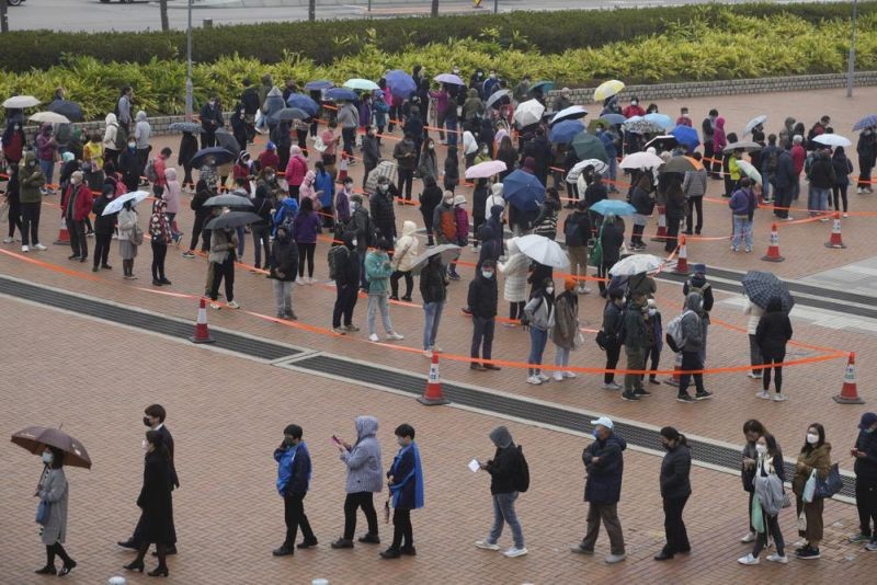 Residents line up to get tested for the coronavirus at a temporary testing center for COVID-19 in Hong Kong Monday, Feb. 7, 2022. The number of local COVID-19 infections in several Asian countries, including Hong Kong and Singapore, have spiked following the Lunar New Year holidays, and are expected to continue to rise as countries grapple with the highly-transmissible omicron variant. (AP Photo)