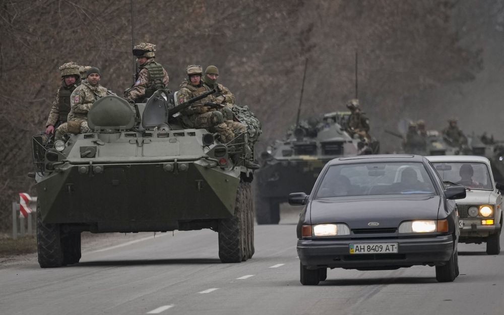 Kramatorsk : Ukrainian servicemen sit atop armored personnel carriers driving on a road in the Donetsk region, eastern Ukraine, Thursday, Feb. 24, 2022. Russian President Vladimir Putin on Thursday announced a military operation in Ukraine and warned other countries that any attempt to interfere with the Russian action would lead to "consequences you have never seen."  AP/PTI(