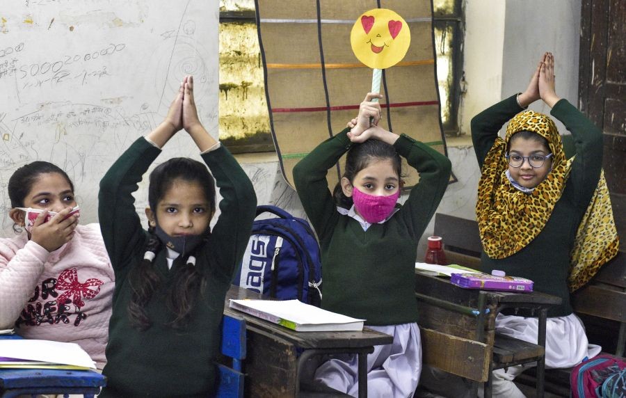 New Delhi: Students attend a class after schools reopened for nursery to VIII standard, as Covid-induced restrictions ease, at a school in New Delhi, Monday, Feb. 14, 2022. (PTI Photo/Vijay Verma)