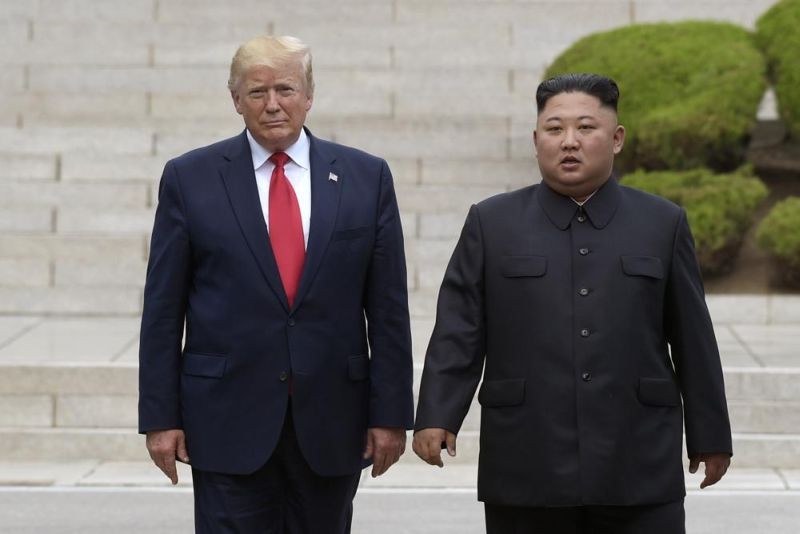 Then U.S. President Donald Trump, left, meets with North Korean leader Kim Jong Un at the North Korean side of the border at the village of Panmunjom in Demilitarized Zone, on June 30, 2019. Former President Trump has criticized the Biden administration over its handling of North Korea, insisting that the country's spree of missile tests in recent weeks wouldn’t have happened if he was still in office. Trump spoke in a recorded video message that was screened on Sunday, Feb. 13, 2022, at a church forum. (AP File Photo)