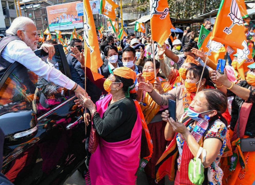 Imphal: Prime Minister Narendra Modi greets supporters during an election campaign rally for upcoming Manipur Assembly elections, in Imphal, Tuesday, Feb. 22, 2022. (PTI Photo)