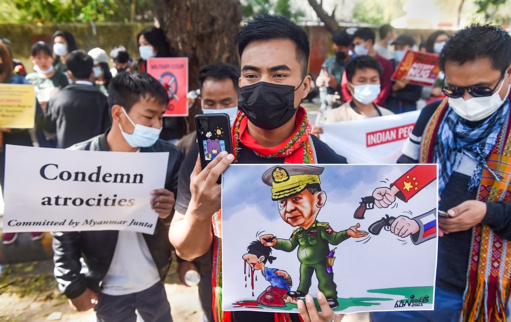 New Delhi: Members of Committee Representing Pyidaungsu Hluttaw (CRPH) and National Unity Government (NUG) support group (India) holding placards, stage a peaceful demonstration against Myanmar's military dictatorship at Jantar Mantar, New Delhi, Tuesday, Feb  22, 2022. (PTI Photo/ Manvender Vashist