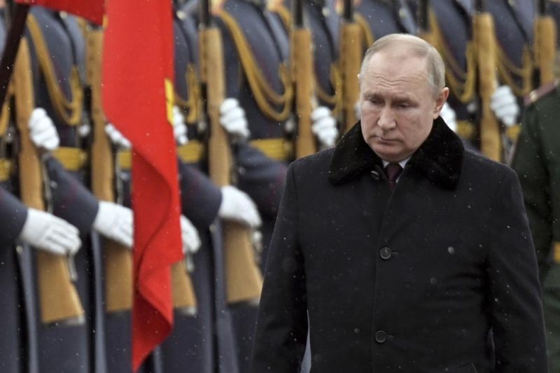 Russian President Vladimir Putin attends a wreath-laying ceremony at the Tomb of the Unknown Soldier, near the Kremlin Wall during the national celebrations of the 'Defender of the Fatherland Day' in Moscow, Russia on February 23,. The Defenders of the Fatherland Day, celebrated in Russia on Feb. 23, honors the nation's military and is a nationwide holiday. (AP Photo)
