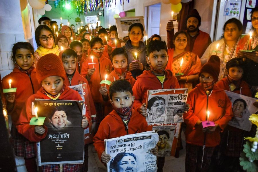 Patna: Students light candles to pay tribute to veteran singer late Lata Mangeshkar at a school, in Patna, Monday, Feb. 7, 2022. Lata Mangeshkar passed away at Breach Candy hospital in Mumbai on Sunday. (PTI Photo)