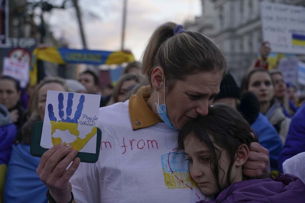 London: A demonstrator holds a placard as she attends a protest outside Downing Street, in London, Friday, Feb. 25, 2022. Russia has launched a full-scale invasion of Ukraine, unleashing airstrikes on cities and military bases and sending troops and tanks from multiple directions in a move that could rewrite the world's geopolitical landscape. AP/PTI