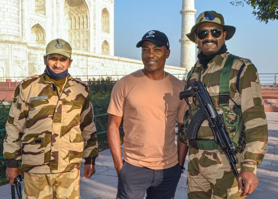 Agra: Former West Indies' cricketer Brian Lara poses for a photograph with security personnel at the Taj Mahal, in Agra, Monday, Feb. 21, 2022. (PTI Photo)