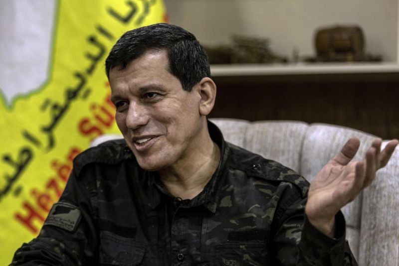 General Mazloum Abdi, the commander of the U.S.-backed Syrian Democratic Forces, speaks during an interview with the Associated Press in Hassakeh, Syria, Thursday, Feb. 10, 2022. Abdi said the Islamic State is a growing threat to northeast Syria in the aftermath of a deadly prison attack and unless immediate action is taken, the extremist group will again flourish. (AP Photo)