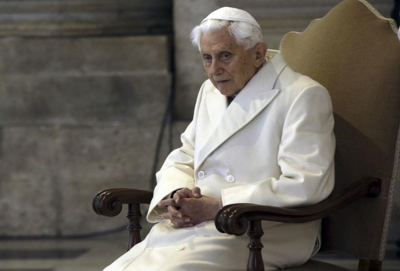 This December 8, 2015 file photo shows Pope Emeritus Benedict XVI sitting in St. Peter's Basilica as he attends the ceremony marking the start of the Holy Year. Retired Pope Benedict XVI asked forgiveness on February 8, 2022, for any “grievous faults" in his handling of clergy sex abuse cases, but admitted to no personal or specific wrongdoing after an independent report criticized his actions in four cases while he was archbishop of Munich, Germany. (AP File Photo)