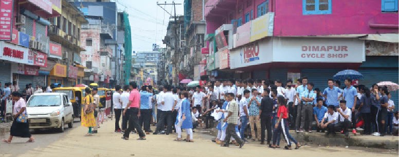 College students seen assembled at Deluxe Point, Dimapur on Wednesday during the indefinite bandh called in protest against alleged mismanagement of scholarship fund. (Morung Photo)