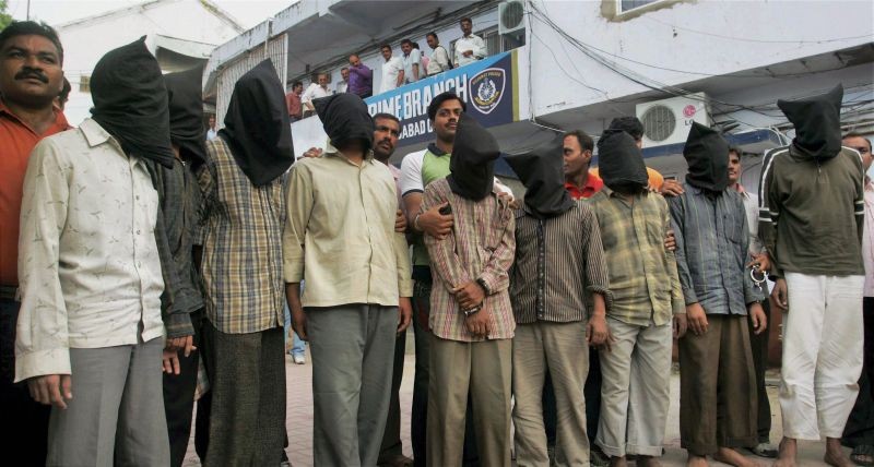 In this Aug. 16, 2008 file photo, suspected militants who were produced by crime branch for their alleged involvement in 2008 Ahmedabad serial blasts. A special court awarded the death sentence to 38 convicts for their involvement in the blasts on February 18, 2022. (PTI File Photo)