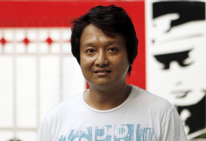 Myanmar filmmaker Htun Zaw Win poses outside his office in Yangon, Myanmar, April 3, 2012. Htun Zaw Win was arrested, Wednesday, Feb. 10, 2022, almost a year after he was put on a wanted list for encouraging government employees to join in protests against the army's seizure of power, according to a colleague and local media reports. (AP File Photo)