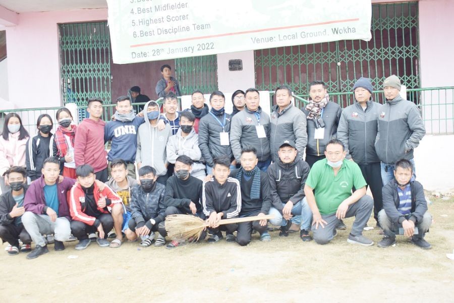 WDFA Officials along with members of Cleanliness Ambassador and players of Tsumang Young Stars posing for lens before the start of the cleanliness drive at local ground.