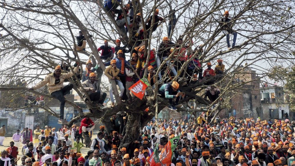 Lakhimpur Kheri: BJP supporters during an election campaign rally for state Assembly polls by Yogi Adityanath,in Lakhimpur Kheri district, Sunday, Feb. 20, 2022. (PTI Photo)