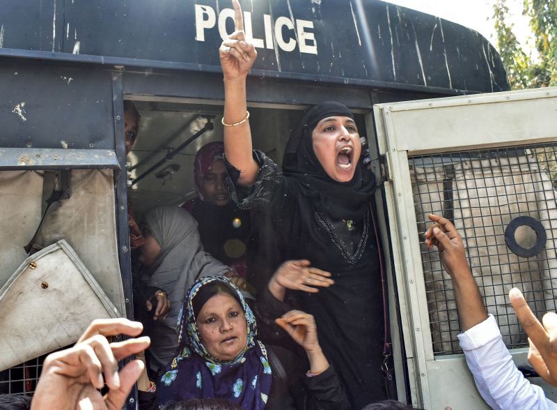 Police arrests the party members of Majlis-e-Ittehadul Muslimeen (MIM) as they participated in a protest rally over the 'Hijab' controversy in Karnataka, in Solapur on February 9, 2022. (PTI Photo)
