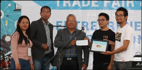 Winner of the NITFaS Rs.50,000 Entrepreneurship Competition & Award with the guest of honour Nibu Nagi, and NITCA President Augustine Reading Kaba.