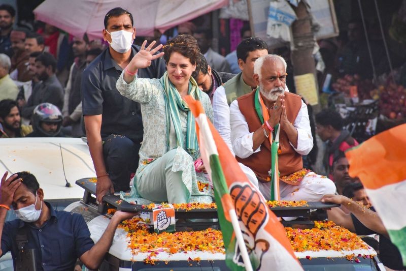 AICC General Secretary Priyanka Gandhi Vadra waves at the people, during a roadshow in support of Congress candidate Ashish Shukla for the UP Assembly elections, in Amethi on February 23. (PTI Photo)