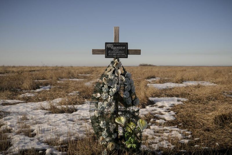 A cross in memory of a Ukrainian soldier is placed in a field near the place he was killed on in 2018, at a front line position outside Popasna, Luhansk region, eastern Ukraine, Monday, Feb. 14, 2022. Russia's Foreign Minister Sergey Lavrov advised President Vladimir Putin on Monday to keep talking with the West on Moscow's security demands, a signal from the Kremlin that it intends to continue diplomatic efforts amid U.S. warnings of an imminent Russian invasion of Ukraine.(AP Photo)