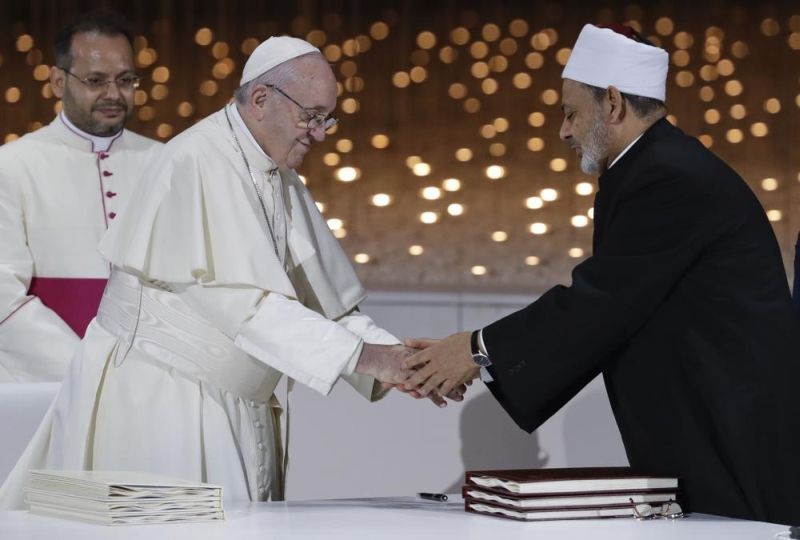 Pope Francis greets Sheikh Ahmad al-Tayyeb, the grand imam of Egypt's Al-Azhar, after an Interreligious meeting at the Founder's Memorial in Abu Dhabi, United Arab Emirates, on Feb. 4, 2019. The Vatican released a statement from President Joe Biden marking the International Day of Human Fraternity, a U.N.-designated celebration of interfaith and multicultural understanding inspired by a landmark document signed on Feb. 4, 2019 in Abu Dhabi by Francis and Sheikh Ahmad al-Tayyeb, the imam of the Al-Azhar center for Sunni learning in Cairo. (AP Photo)