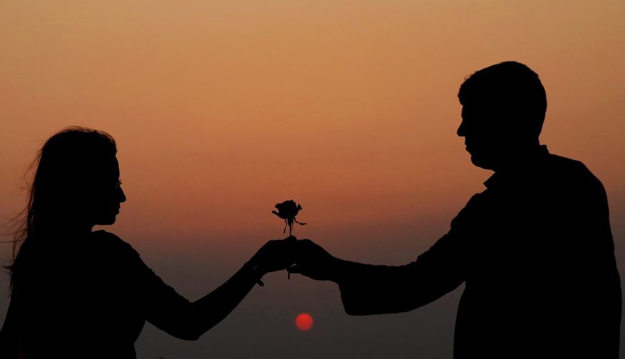 Birbhum: A couple near the banks of the Kopai river, on the eve of Valentines' Day, in Birbhum district, Sunday, Feb. 13, 2022. (PTI Photo)(