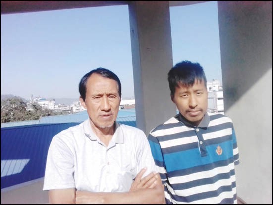 T Longlong Konyak (right) seen here with his father, Tongna Konyak (left), after the Guwahati Medical College provided Longlong with Hemophilia medicines and treatment free of charge under the Ayushman Bharat scheme. Readers may recall Longlong’s morbid condition when The Morung Express first covered his plight at the Dimapur Government Hospital in October 2018. (Photo Courtesy: T Methna Konyak)