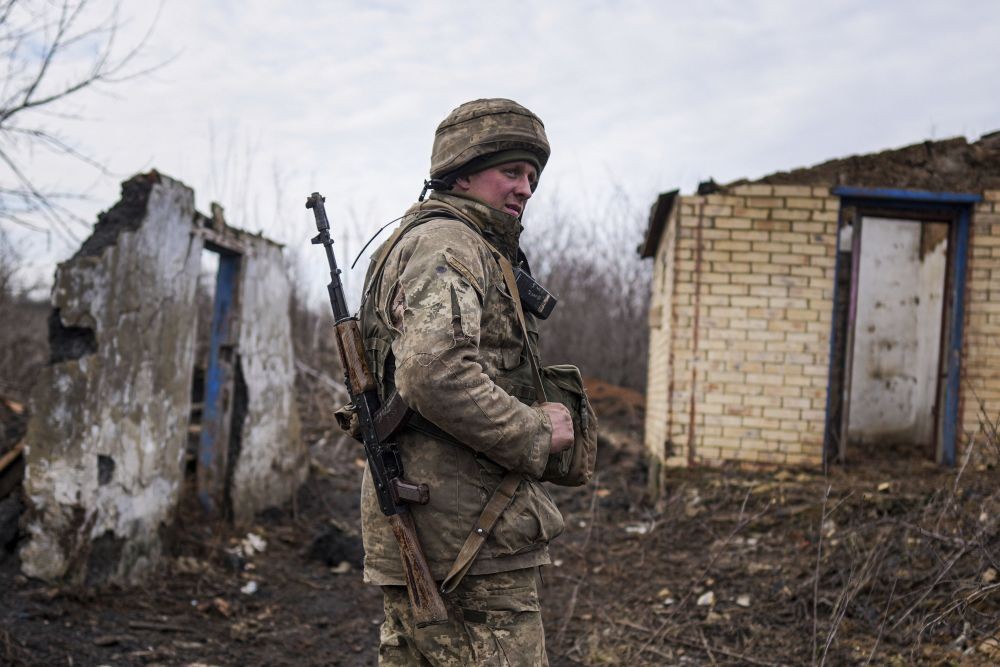 Svitlodarsk: A Ukrainian serviceman stands at his position at the line of separation between Ukraine-held territory and rebel-held territory near Svitlodarsk, eastern Ukraine, Wednesday, Feb. 23, 2022. U.S. President Joe Biden announced the U.S. was ordering heavy financial sanctions against Russia, declaring that Moscow had flagrantly violated international law in what he called the "beginning of a Russian invasion of Ukraine." AP/PTI