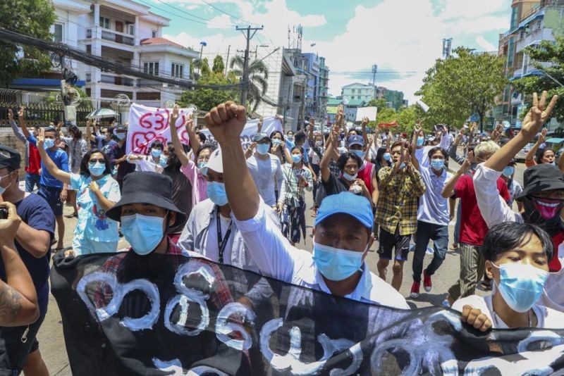 Anti-coup protesters march during a demonstration in Yangon, Myanmar on May 12, 2021. Some human rights advocates are urging governments to impose sanctions against supplying aviation fuel to Myanmar as its security forces carry out air strikes against opponents of the army-led administration. (AP File Photo)