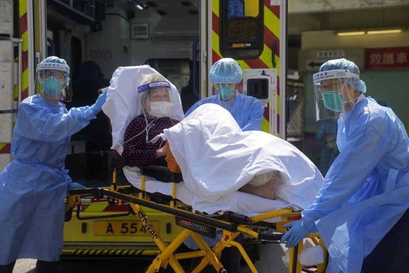 - Medical workers wearing protective gear move an elderly patient from an ambulance to a hospital in Hong Kong, Friday, March 4, 2022. Hong Kong's total coronavirus infections exceeded 1 million on Friday, March 18, 2022, amid a widespread outbreak and thousands of deaths in recent weeks. (AP File Photo)