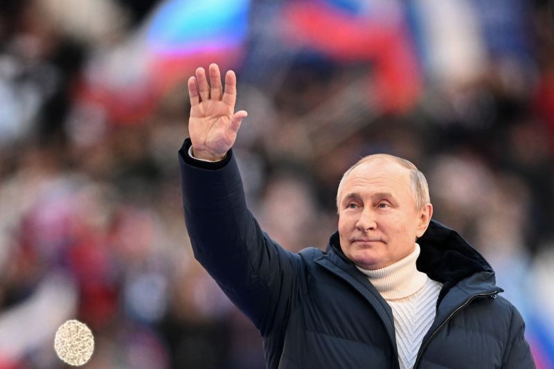 Russian President Vladimir Putin greets people gathered to attend the concert marking the eighth anniversary of the referendum on the state status of Crimea and Sevastopol and its reunification with Russia, in Moscow, Russia on March 18. (AP/PTI Photo)