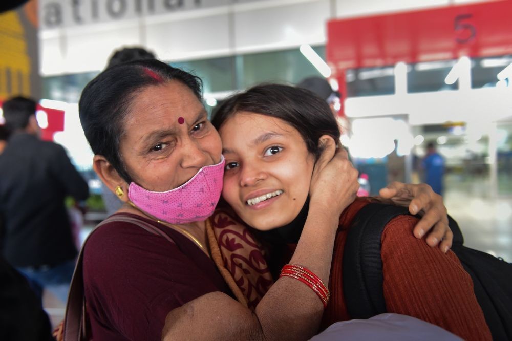 New Delhi: A relative greets an Indian national, evacuated from war-torn Ukraine, upon her arrival at the Indira Gandhi International Airport, in New Delhi, Friday, March 11, 2022. (PTI Photo/Kamal Kishore)