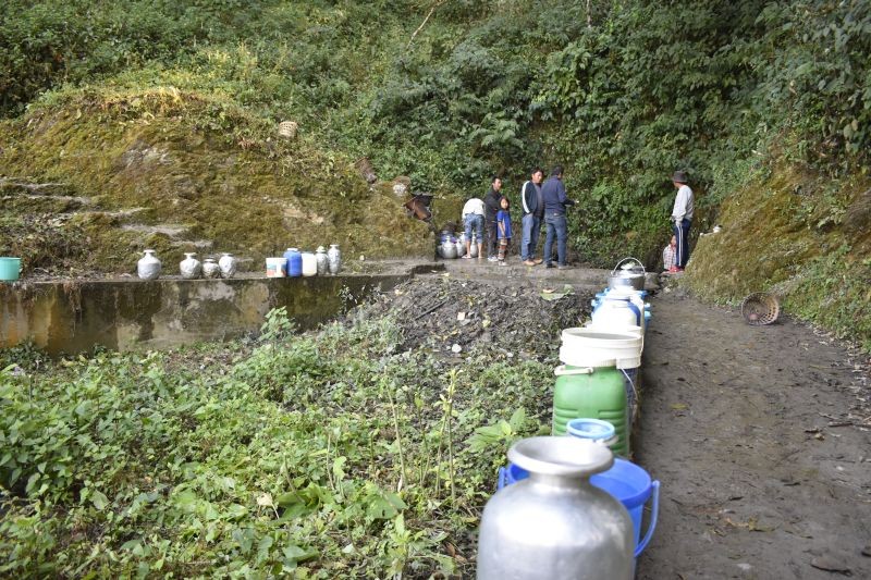 Pitchers and buckets for collecting water are seen line-up near water hole in Zunheboto. (Aghato Zhimomi Photo)