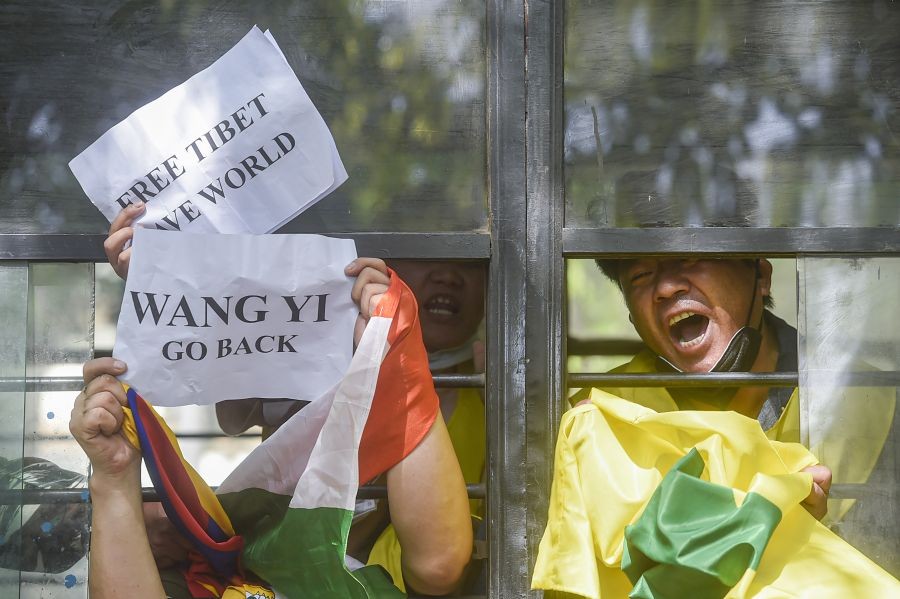 New Delhi: Police personnel detain members of Tibetan Youth Congress (TYC) during their protest over the arrival of China's Foreign Minister Wang Yi, in front of Hyderabad House, in New Delhi, Friday, March 25, 2022. (PTI Photo/Arun Sharma)