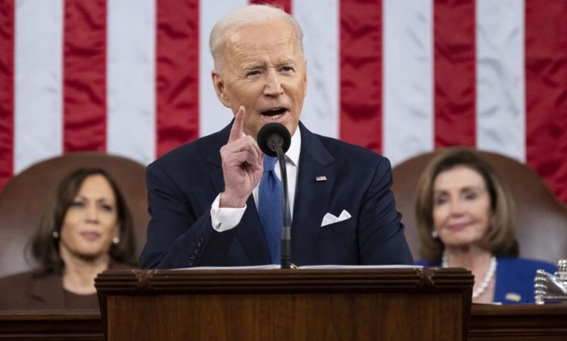 President Joe Biden delivers his first State of the Union address to a joint session of Congress at the Capitol, as Vice President Kamala Harris and House Speaker Nancy Pelosi of Calif., watch, Tuesday, March 1, 2022, in Washington. (AP Photo)