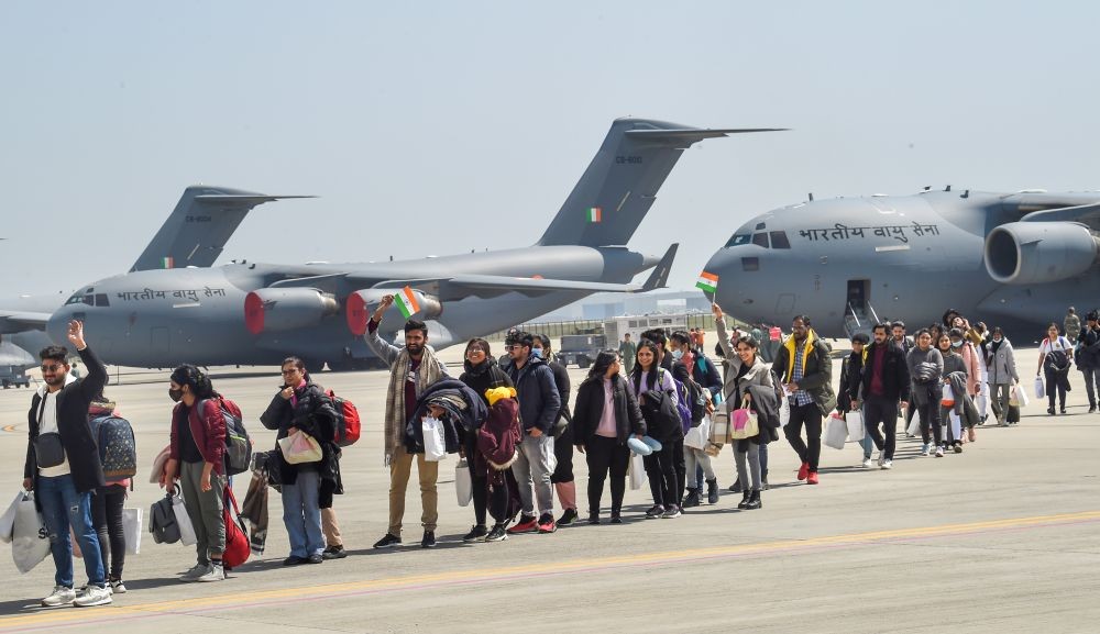 Ghaziabad: Indian nationals walk after deboarding from an IAF plane with evacuated people from war-hit Ukraine, upon its arrival at Hindan in Ghaziabad, Friday, March 11, 2022.  Indian Air Force C17 Globemaster carrying 213 students  arrived from Sumy . (PTI Photo/Manvender Vashist)