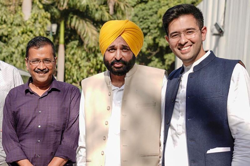 AAP's Punjab Chief Minister-elect Bhagwant Mann with Delhi CM and party convenor Arvind Kejriwal and party leader Raghav Chadha in New Delhi on March 11, 2022. (PTI Photo)