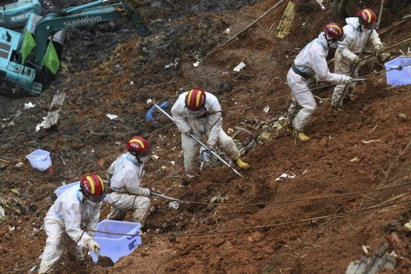 In this photo released by Xinhua News Agency, search and rescuer workers conduct continued search operations at the China Eastern flight crash site in Tengxian County on Saturday, March 26, 2022, in southern China's Guangxi Zhuang Autonomous Region. The second "black box" has been recovered from the crash of a China Eastern Boeing 737-800 that killed 132 people last week, Chinese state media said Sunday. (AP Photo)